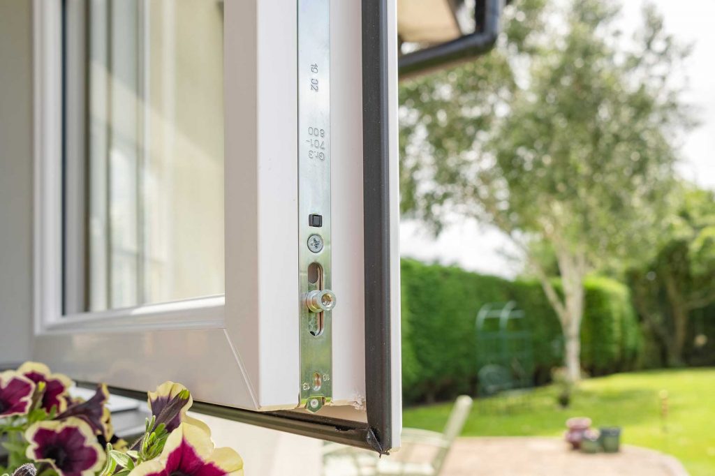 Open uPVC window showing the multipoint locking mechanism