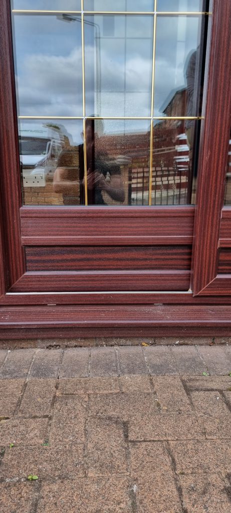 A new rosewood door panel fitted to the same door, matched to the existing frame