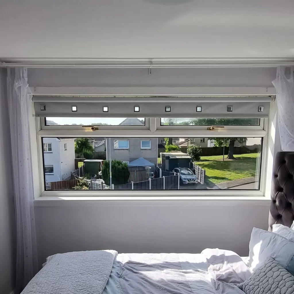 New sealed unit in the same window, houses and cars outside sharp again