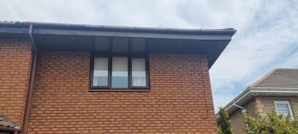 The same brown uPVC window with new sealed units fitted and clear glass