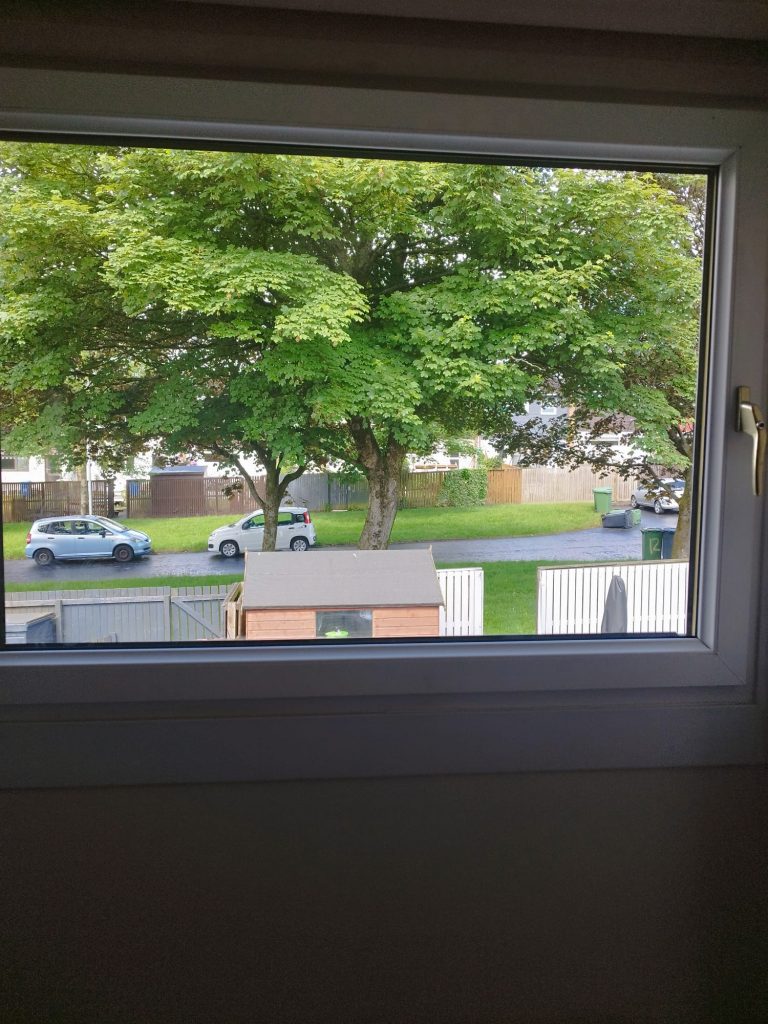 The same oak effect window with a new sealed unit and a clear view out
