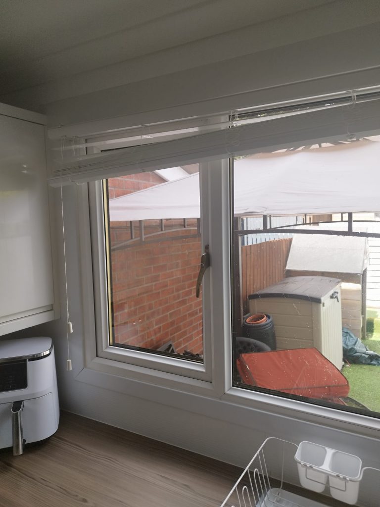 The same uPVC window with a new sealed unit fitted and the view outside clear again